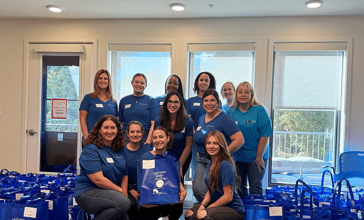 Volunteers gathered at an evening Family Nurturing Center event