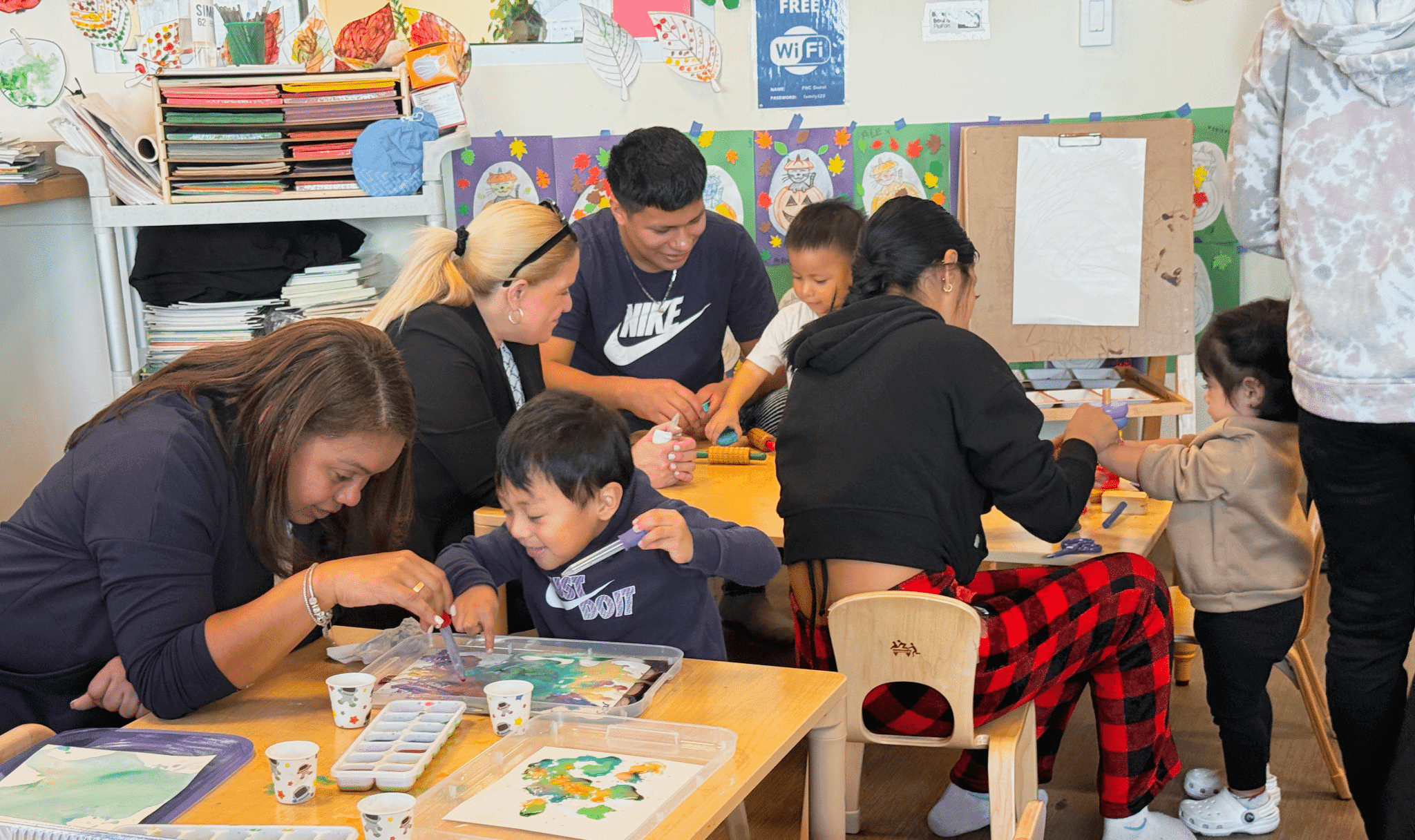 A parent and young child sharing a moment together at a Family Nurturing Center program